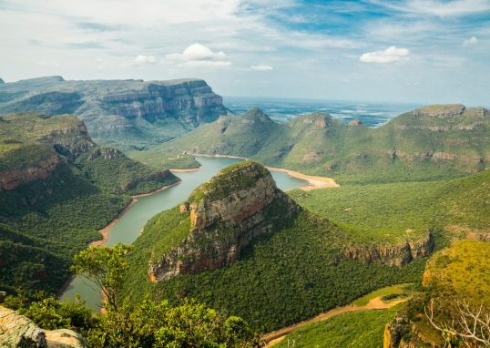 landscape photography of mountains under blue sky