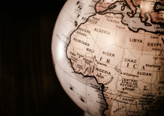 white and brown desk globe