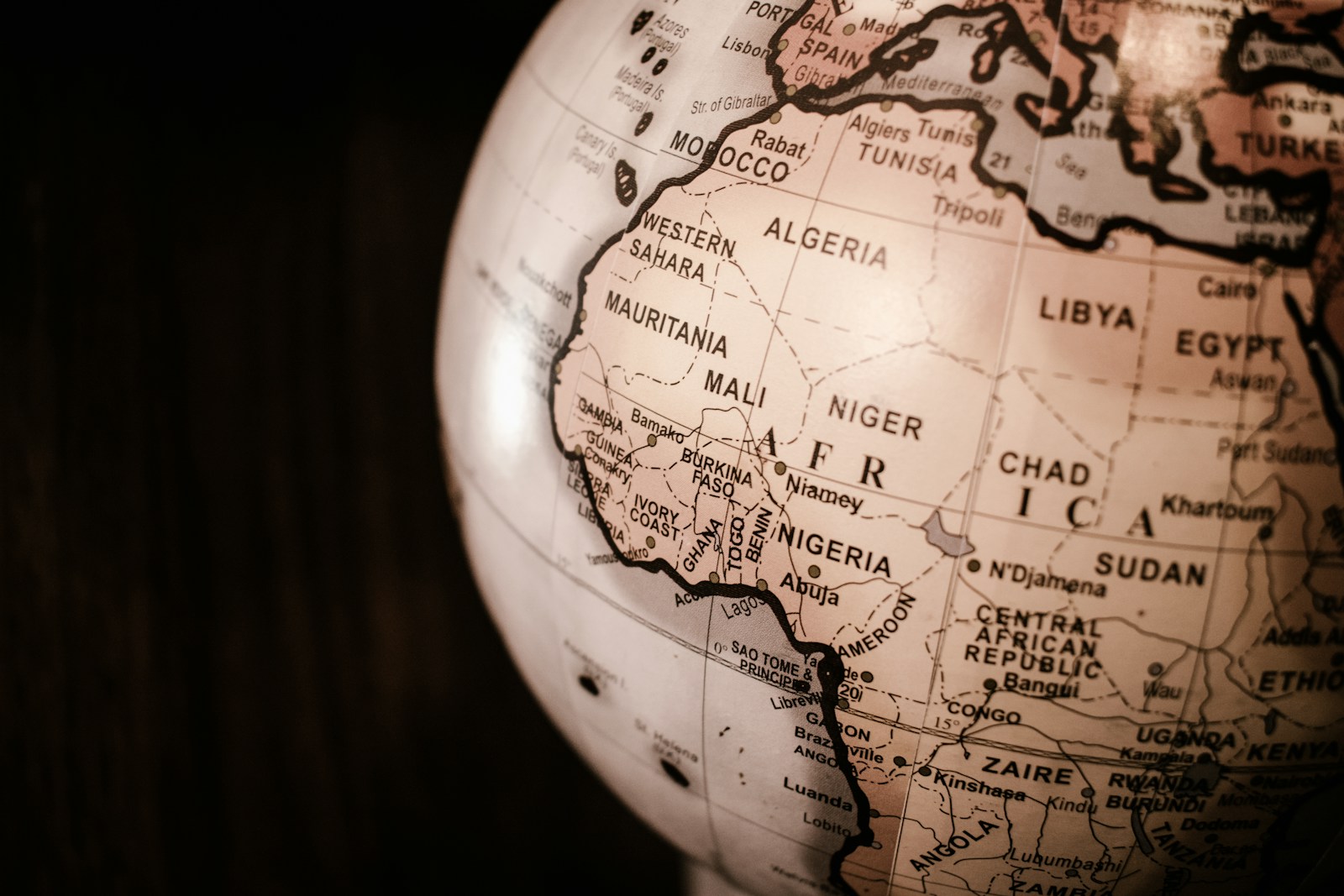 white and brown desk globe