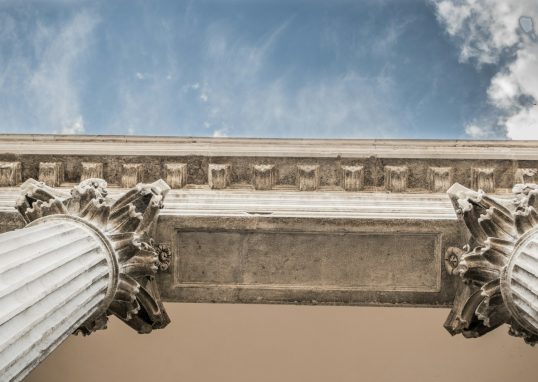 worm eye view of white concrete pillar during day time